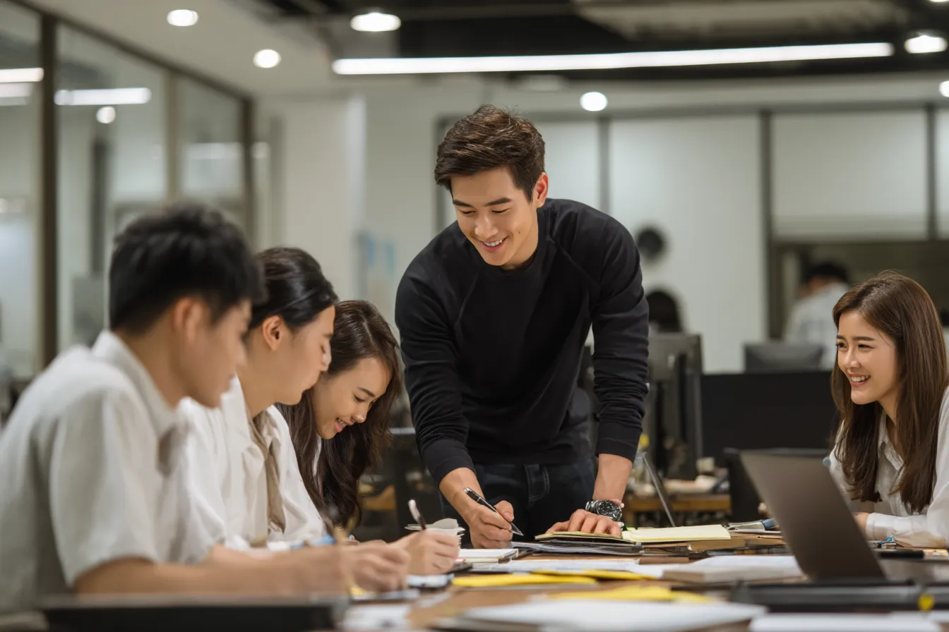 a_group_of_young_asian_office_workers_in_an_open