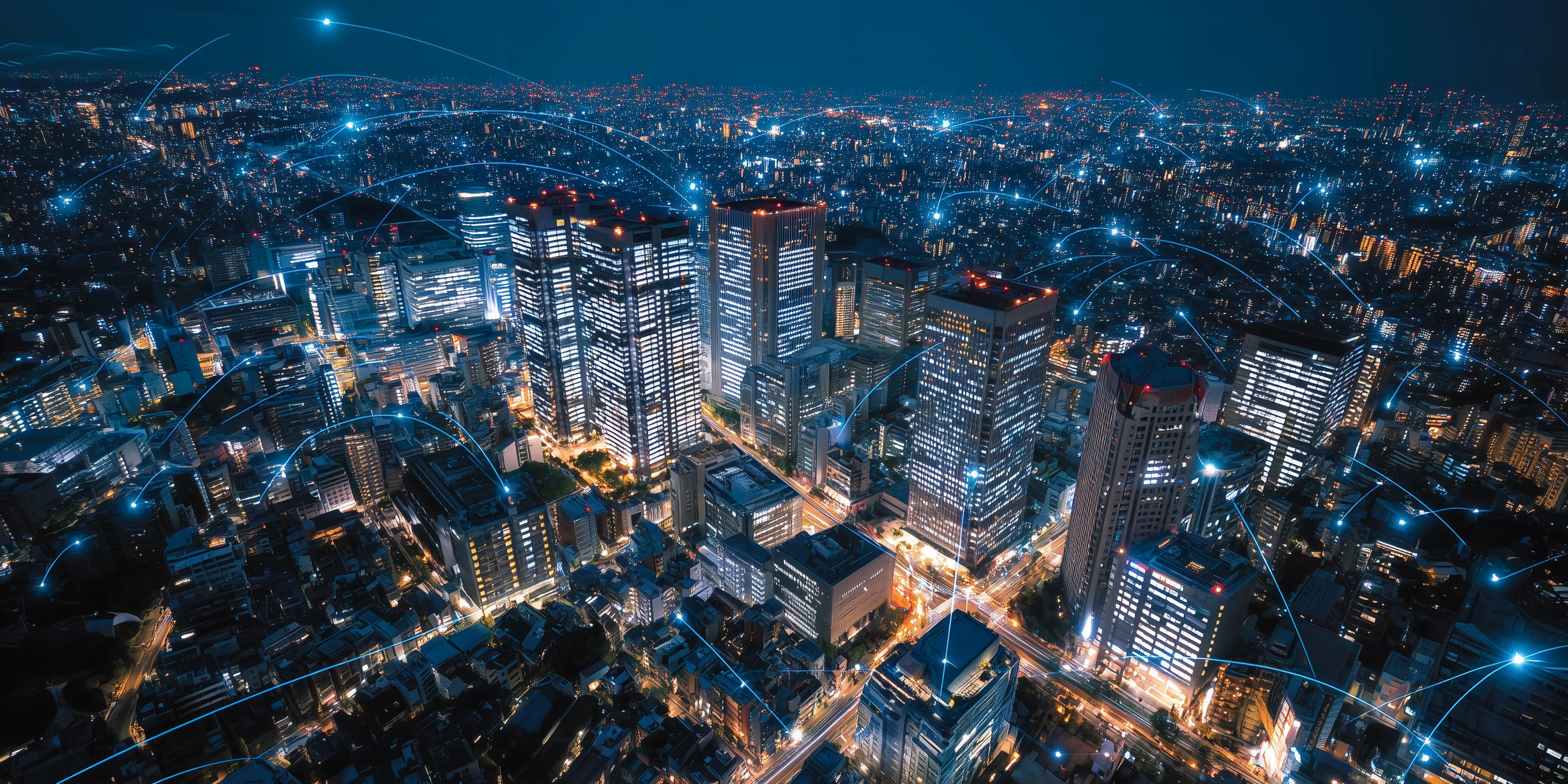 City skyline at night with lit buildings