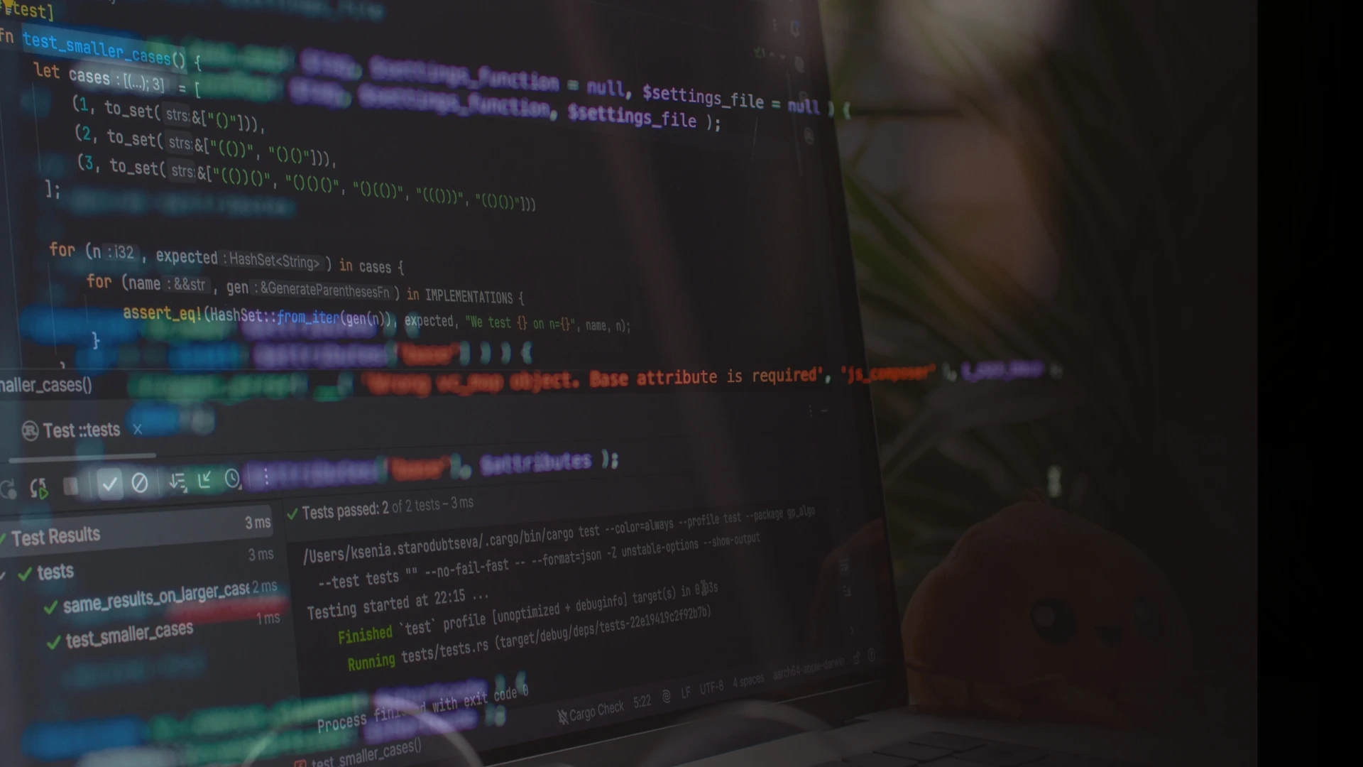 A dark code editor on screen with a passing test results panel